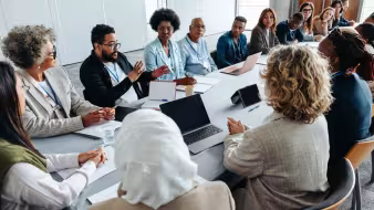 A group of people in a meeting.