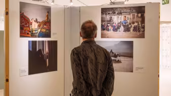 A person views photos in an art exhibition