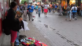 Merchants sell items on a busy street in San Jos&eacute;, Costa Rica.