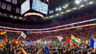 International students wave flags of their origin countries