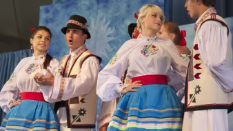 Four dancers in traditional Ukrainian dress.