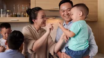 A Vietnamese family in the kitchen. 