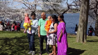 A family takes a photo in Washington, DC.