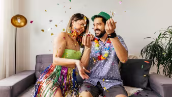 A couple celebrating carnival at home.