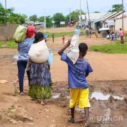 A group of Ethiopian refugees walk througha camp. (Photo: &copy; UNHCR/Olga Sarrado Mur)