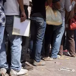People in Nepal wait for a work visa for South Korea.